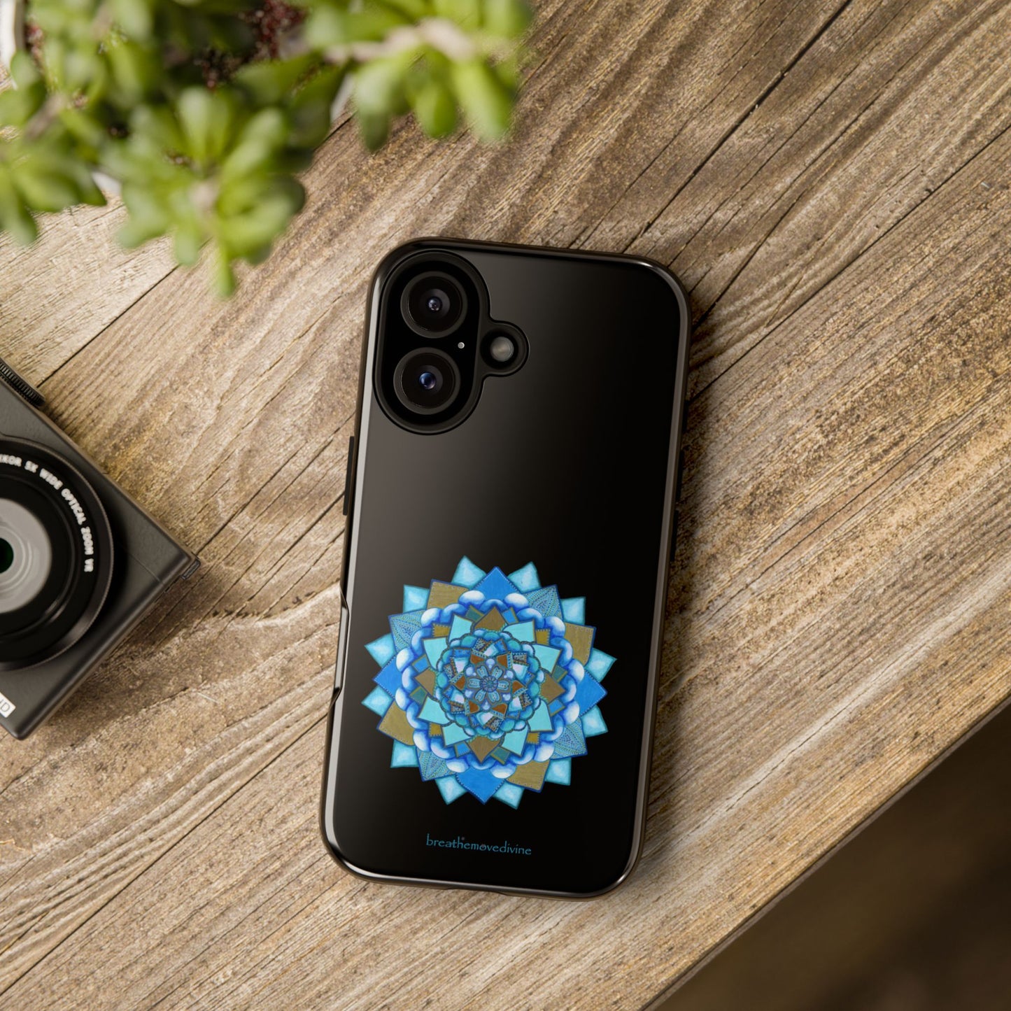 Black smartphone with a decorative blue and gold pattern on a white background